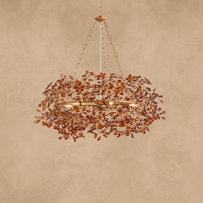 Faverelle chandelier in red-copper finish with crystal blossoms, illuminated