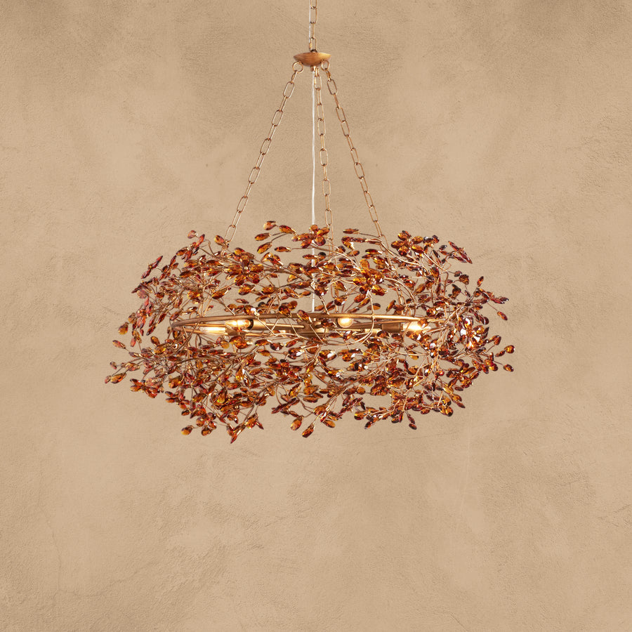 Faverelle chandelier in red-copper finish with crystal blossoms, illuminated