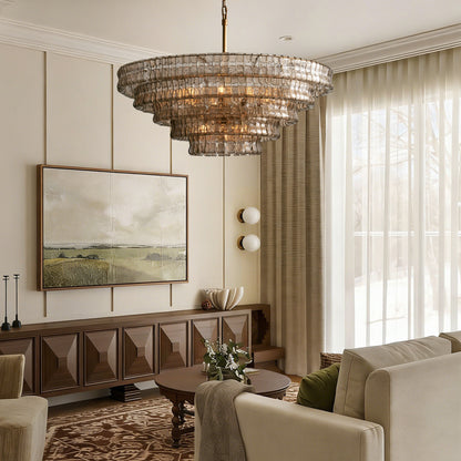 Givrelle round chandelier by the window in a warm minimalist living room