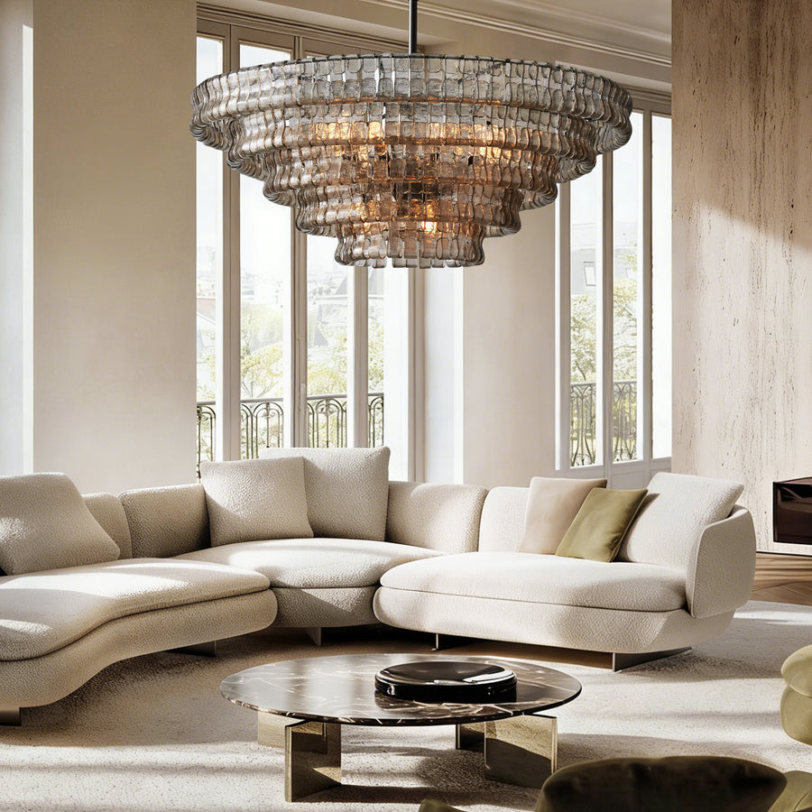 Givrelle round chandelier over a curved sofa in a contemporary living room