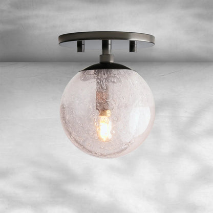Mirandel Hand‑Blown Glass Wall Sconce with Rustic Industrial Charm