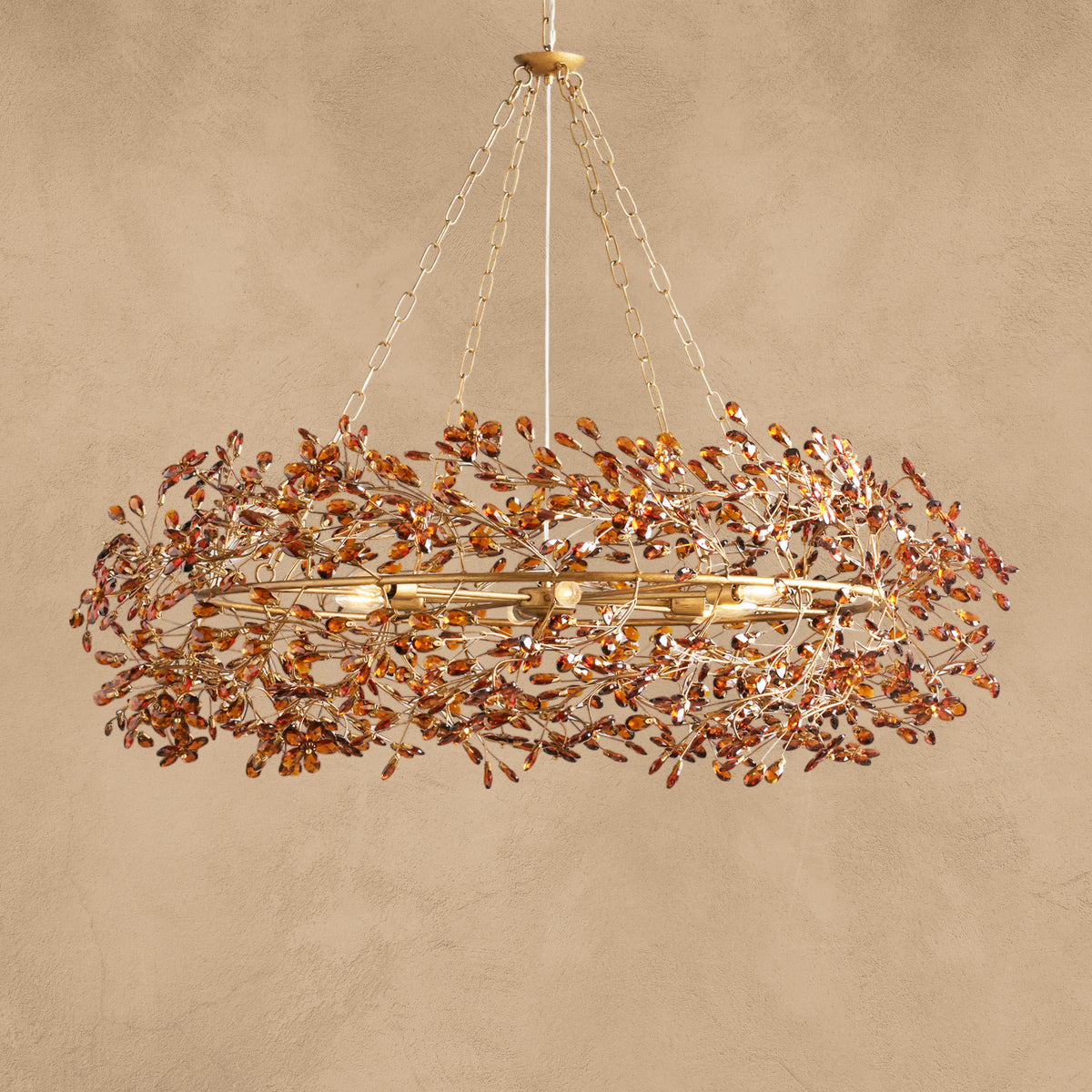 Faverelle chandelier in red-copper finish, crystal crown, lit