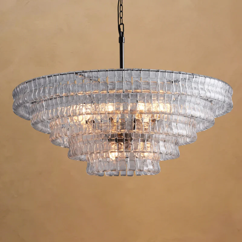 Ghiaccio round chandelier with clear glass shades, lit studio view