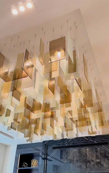 https://cdn.shopify.com/s/files/1/0554/8562/8591/files/modern_glass_chandelier.jpg?v=1773483270